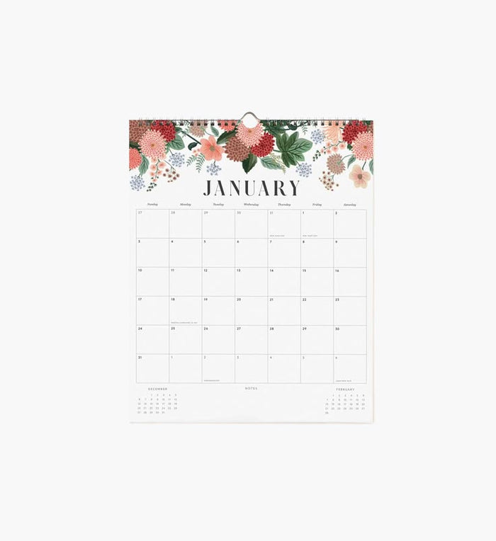 A single-page January desk calendar with a floral border at the top, shown hanging against a plain light background.