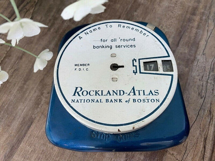 RL. Midcentury Advertising Add a Coin Bank at Duckwells