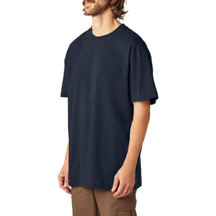 Man wearing navy blue short sleeve crew neck t-shirt with brown cargo pants.