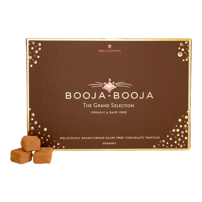 A box of Booja-Booja 'The Grand Selection' organic and dairy-free chocolate truffles, shown with three individual truffles in the foreground on a white background.