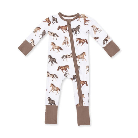 A baby long-sleeve footed sleeper with a white background covered in a brown and tan horse print, featuring solid brown cuffs and foot cuffs, and a brown front zipper.