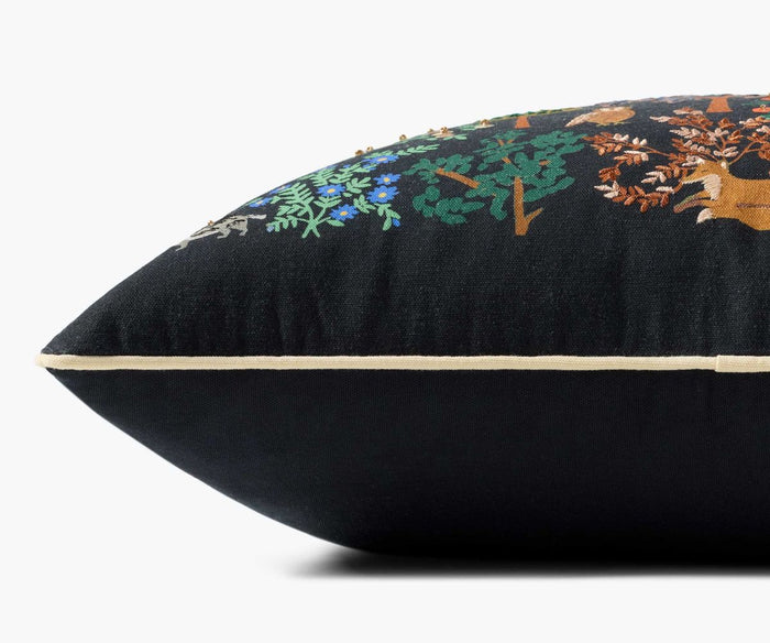 Black pillow with floral embroidery on a white background